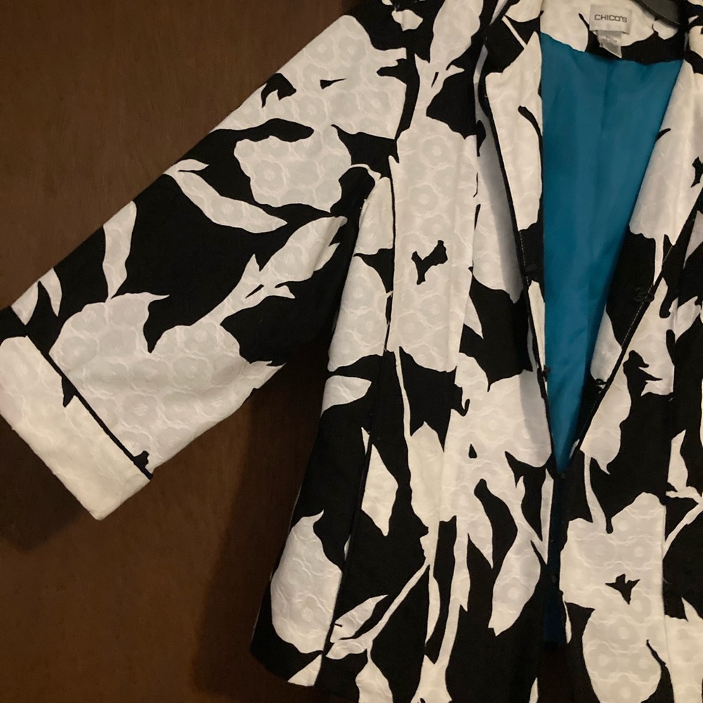 Chicos black and white jacket with hook closure. Turquoise lining